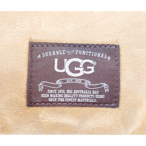 1276 - An Ugg canvas and brown leather messenger bag, 42cm wide