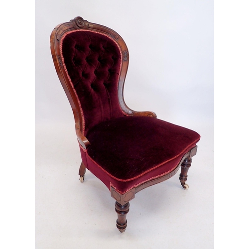 1279 - A Victorian red upholstered chair with incised decoration on turned supports