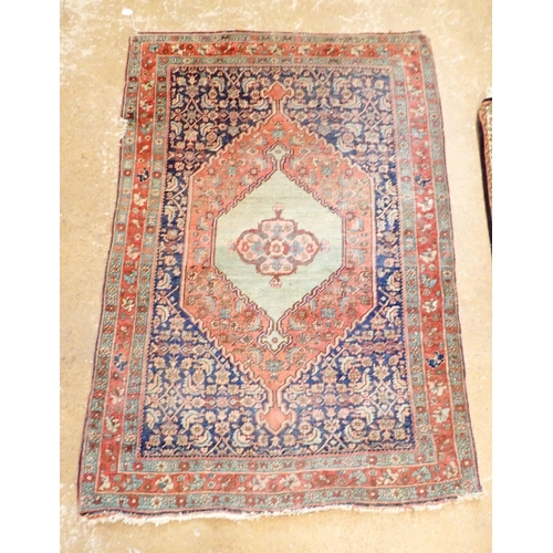 1283 - A Persian style rug with medallion design on a blue ground within multiple borders 164 x 112cm