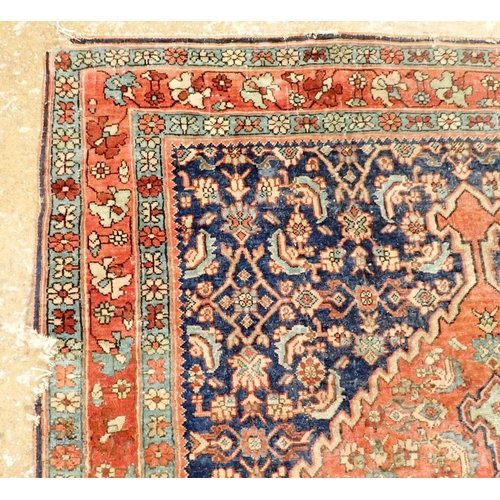 1283 - A Persian style rug with medallion design on a blue ground within multiple borders 164 x 112cm