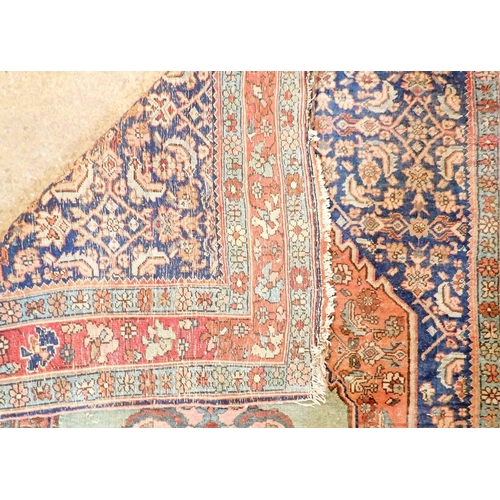 1283 - A Persian style rug with medallion design on a blue ground within multiple borders 164 x 112cm