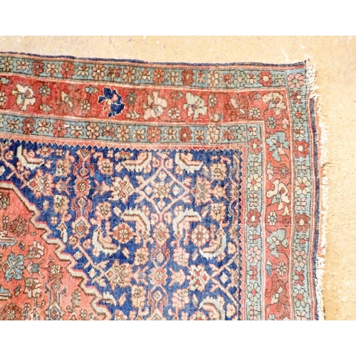 1283 - A Persian style rug with medallion design on a blue ground within multiple borders 164 x 112cm