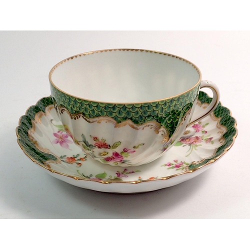 129 - A Dresden floral painted cup and saucer