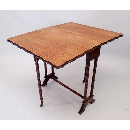 1291 - An Edwardian oak Sutherland table with wavy edge on turned supports, 62cm high x 61cm wide