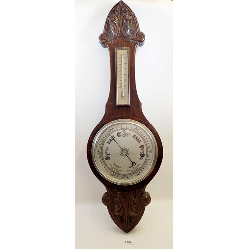 1296 - A Victorian carved oak barometer/thermometer,  80cm long