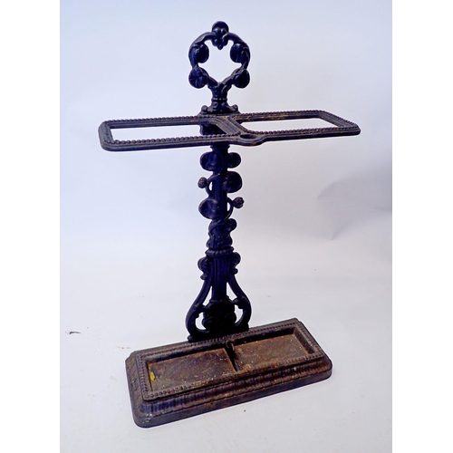 1297 - A cast iron stick stand, 68cm tall