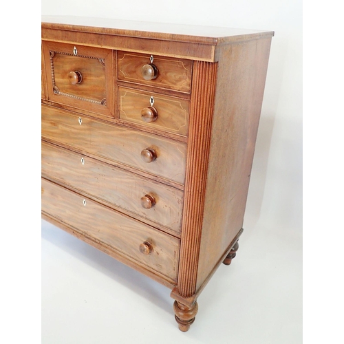 1299 - A Victorian mahogany Scotch chest with hat drawer flanked by four small drawers over three long draw... 