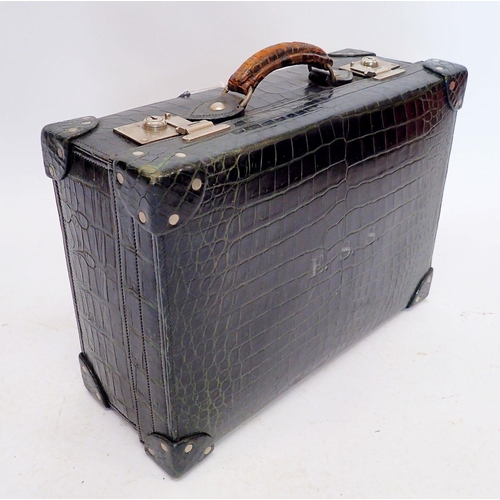 1301 - A dark green leather gentleman's travelling suitcase fitted with correspondence folders, inkwell, pe... 