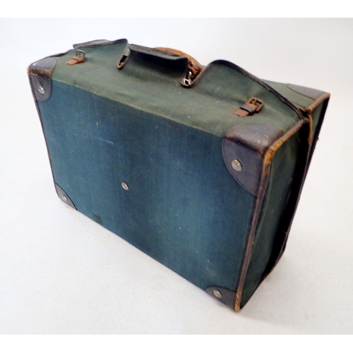 1301 - A dark green leather gentleman's travelling suitcase fitted with correspondence folders, inkwell, pe... 