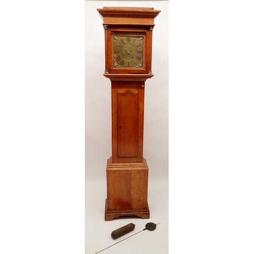 1303 - An early 18th century oak longcase clock, the brass dial with one hand and angel mask spandrels, by ... 