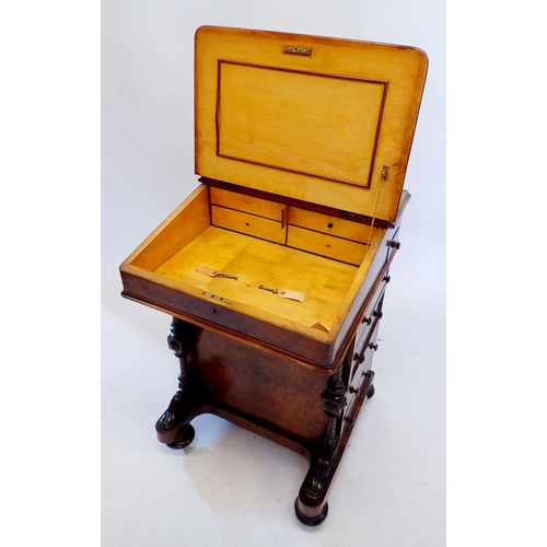 1305 - A Victorian walnut Davenport with slope front enclosing satinwood fitted interior all on turned and ... 