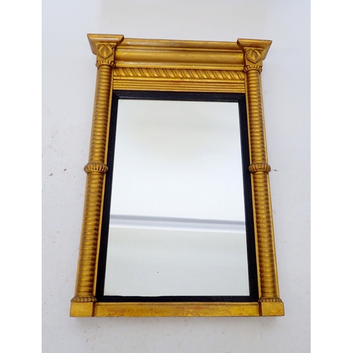 1309 - A late 19th century gilt framed classical style mirror with turned columns and pediment, 57 x 41cm