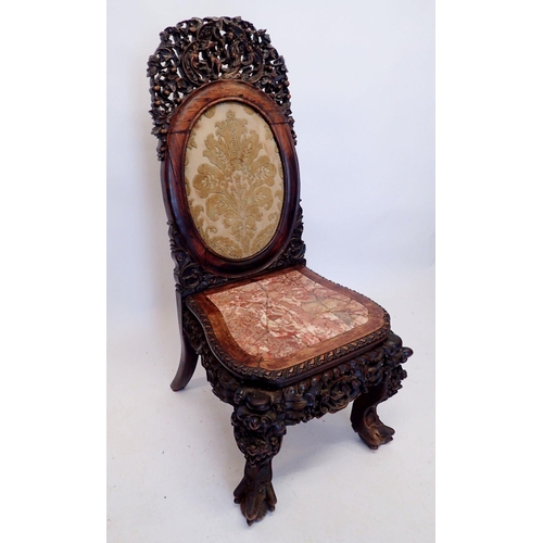 1313 - A 19th century Chinese hardwood chair with marble seat and ornately carved decoration