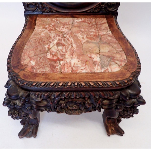 1313 - A 19th century Chinese hardwood chair with marble seat and ornately carved decoration