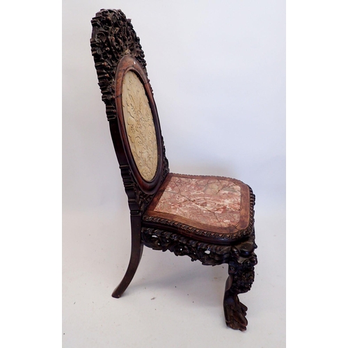 1313 - A 19th century Chinese hardwood chair with marble seat and ornately carved decoration