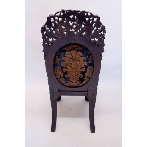 1313 - A 19th century Chinese hardwood chair with marble seat and ornately carved decoration