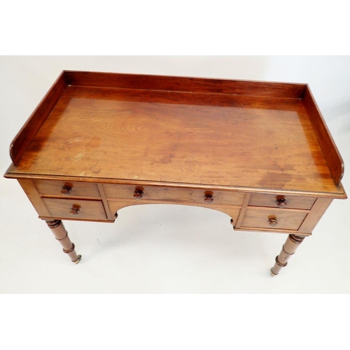 1319 - An early 19th century mahogany dressing table with five drawers raised on slender turned supports, 1... 