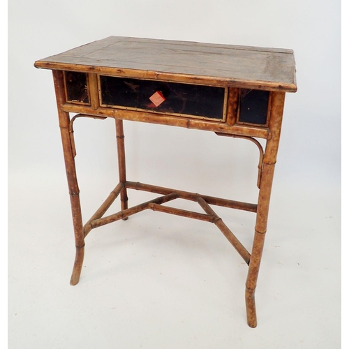 1320 - A small 1920's bamboo side table with frieze drawer, the top with varnished Pierrot printed paper