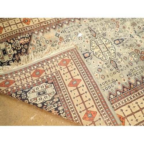 1323 - A Turkoman style rug with stylised floral motifs on a blue grey ground 188 x 123cm