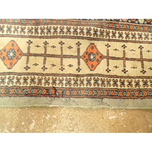 1323 - A Turkoman style rug with stylised floral motifs on a blue grey ground 188 x 123cm