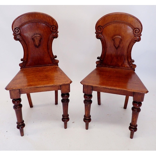 1330 - A pair of Victorian oak shield back hall chairs