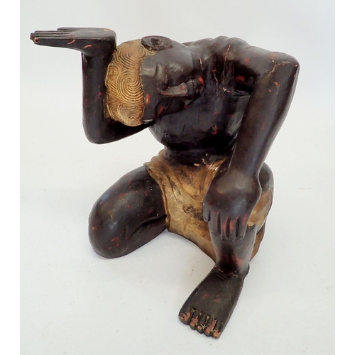 1333 - A glass table on carved wood kneeling figure base, 51cm diameter