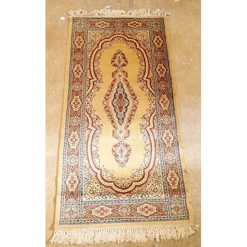 1334 - A small Persian style rug on a yellow ground, 175cm long x 90cm wide