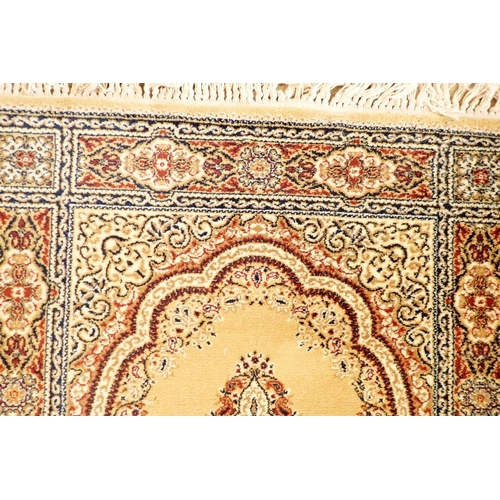 1334 - A small Persian style rug on a yellow ground, 175cm long x 90cm wide