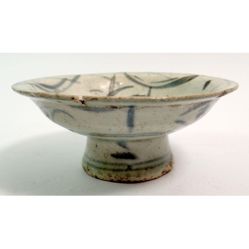 134 - An antique Chinese blue and white provincial small porcelain pedestal dish, 10cm diameter