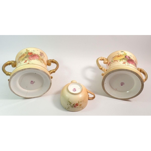 136 - A Royal Worcester ivory blush pair of large two handled loving cups 15cm tall and a similar invalid ... 