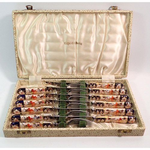 138 - A cased set of Royal Crown Derby Imari knives and forks with Imari handles