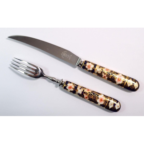 138 - A cased set of Royal Crown Derby Imari knives and forks with Imari handles