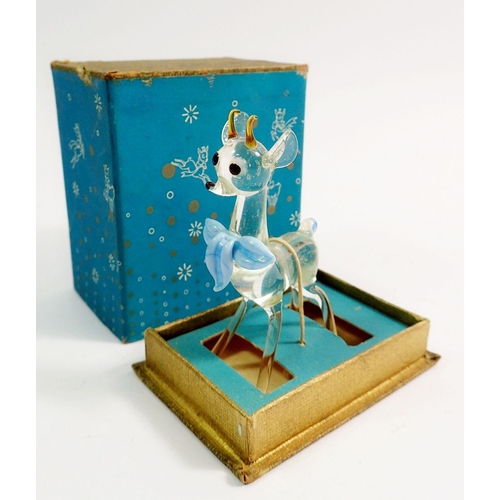 140 - Six Babycham glasses, two ceramic deers and a glass deer in original box