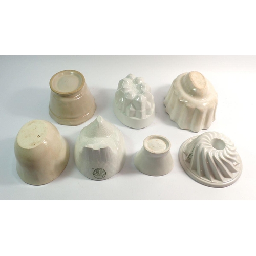 16 - A Copeland POW feather jelly mould, a Greens chicken jelly mould and five other jelly moulds