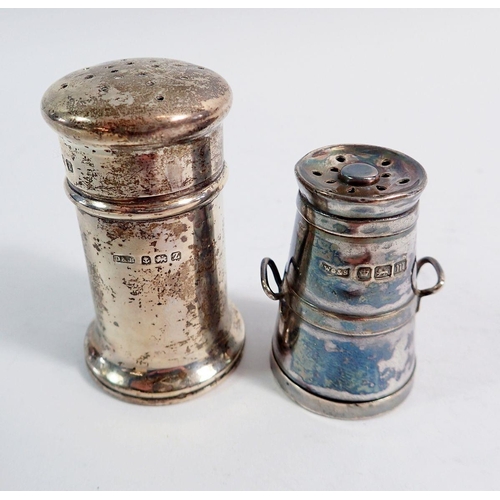 229 - A novelty silver milk churn pepper pot, a jug form pepper pot and one other pepper, two silver shell... 