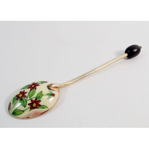 285 - A set of six white metal and enamel coffee spoons with floral decoration and coffee bean to terminal... 