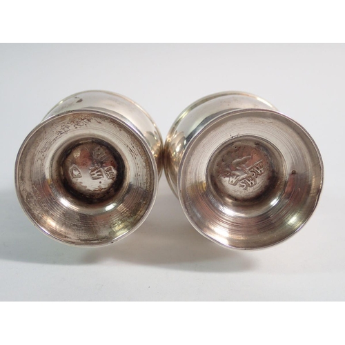 289 - A pair of George II silver casters, 11cm, London 1732 probably Samuel Welder, one struck SW three ti... 