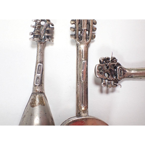 291 - A group of four Italian silver 800 standard miniatures comprising gondola, 9cm, two mandolins and gu... 