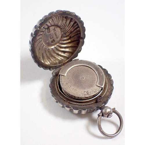 295 - A silver spiral reeded circular sovereign case, London 1885 by Sampson Mordan