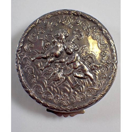 299 - A silver circular trinket box embossed cherubs, 5.5cm diameter, import mark 1979