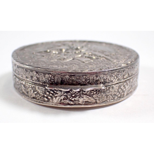 299 - A silver circular trinket box embossed cherubs, 5.5cm diameter, import mark 1979