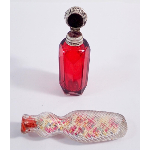 311 - A Victorian red glass scent bottle with silver lid, 7cm and a spiral moulded candy bottle sealed wit... 