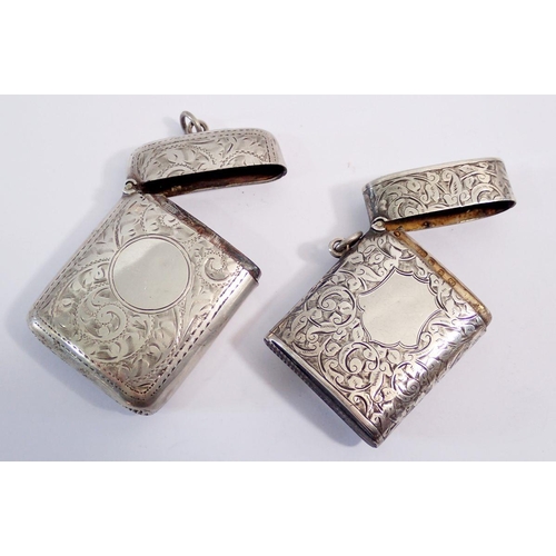 327 - Two silver vesta cases, Birmingham 1899 & 1908, 69g, with engraved foliage decoration