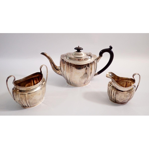 373 - A silver three piece tea service with fluted decoration, Birmingham 1931, 1110g