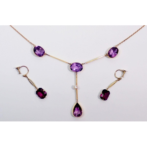 380A - An Edwardian 9 carat gold pendant necklace set four oval cut amethyst and pearl drops with similar a... 