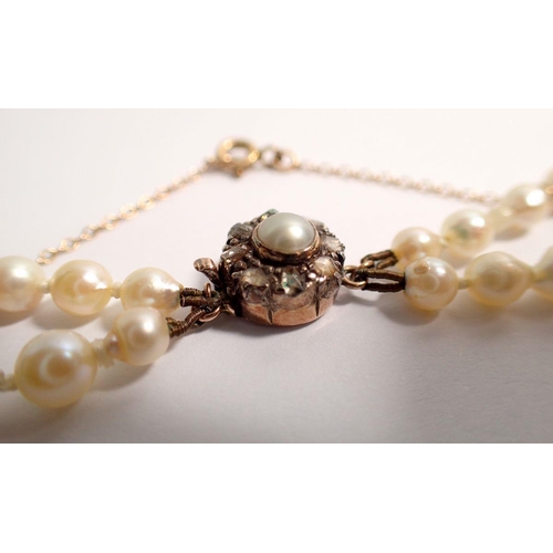 382 - An antique double row graduated pearl necklace with gold clasp set old cut diamonds with safety chai... 