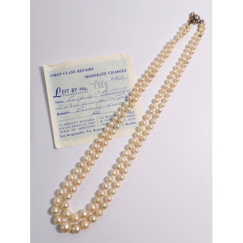 382 - An antique double row graduated pearl necklace with gold clasp set old cut diamonds with safety chai... 