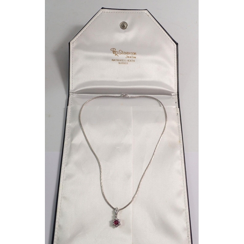 383 - An 18 carat white gold ruby and diamond floral cluster pendant necklace, diamond weight 0.62cts each... 