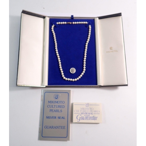 385 - A single string of pearls with 9 carat gold clasp, 48cm long - in Mikimoto box