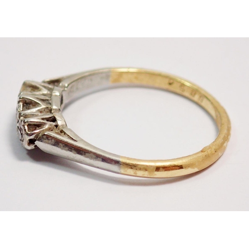 402 - An Edwardian 18 carat gold ring illusion set three chip diamonds, size I-J, 2g